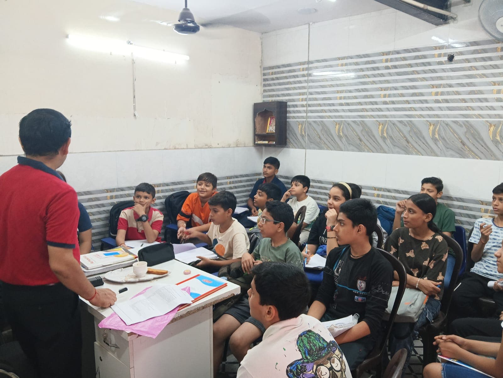 Teacher engaging a junior class