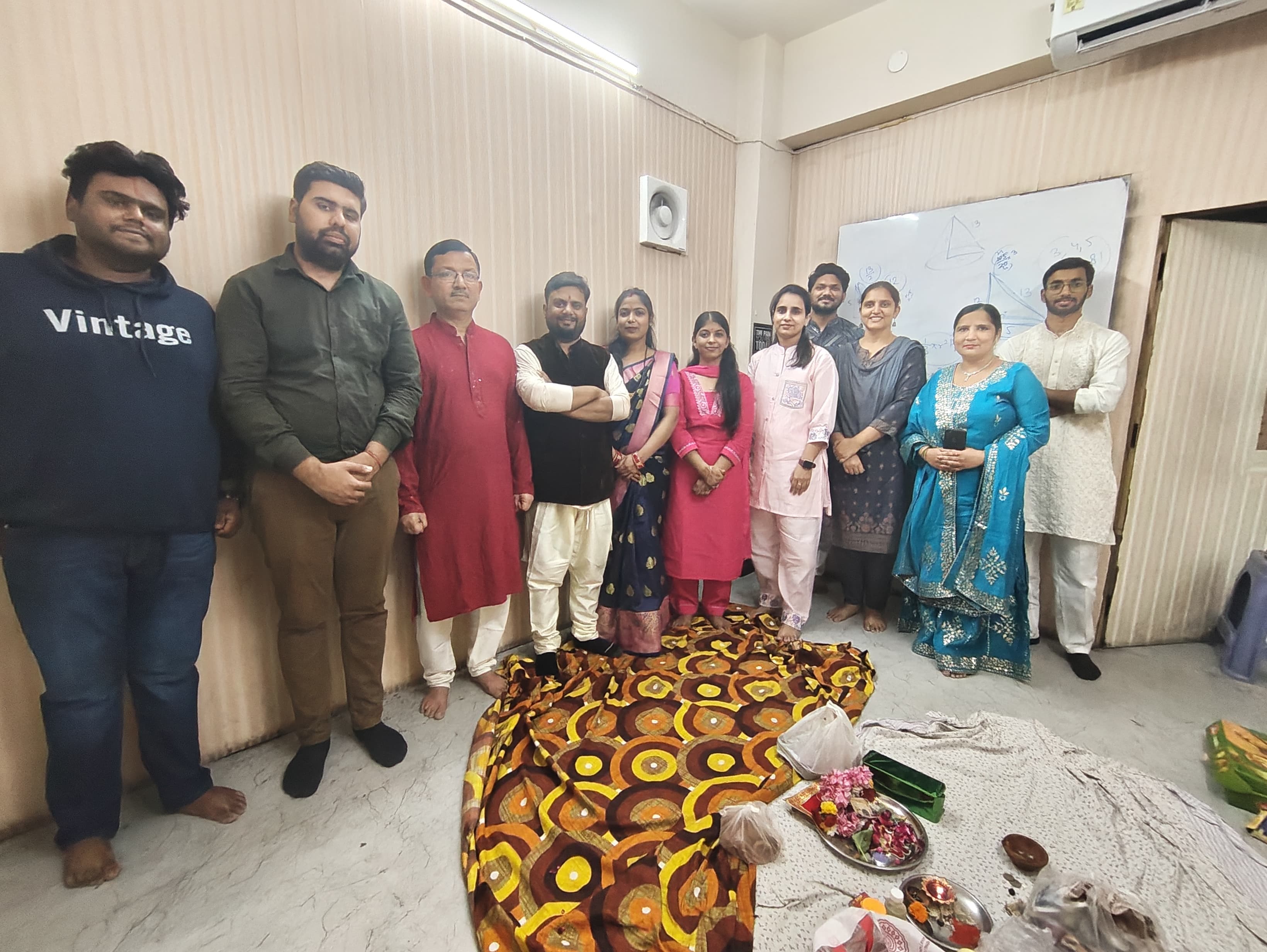 Faculty exchanging festival sweets