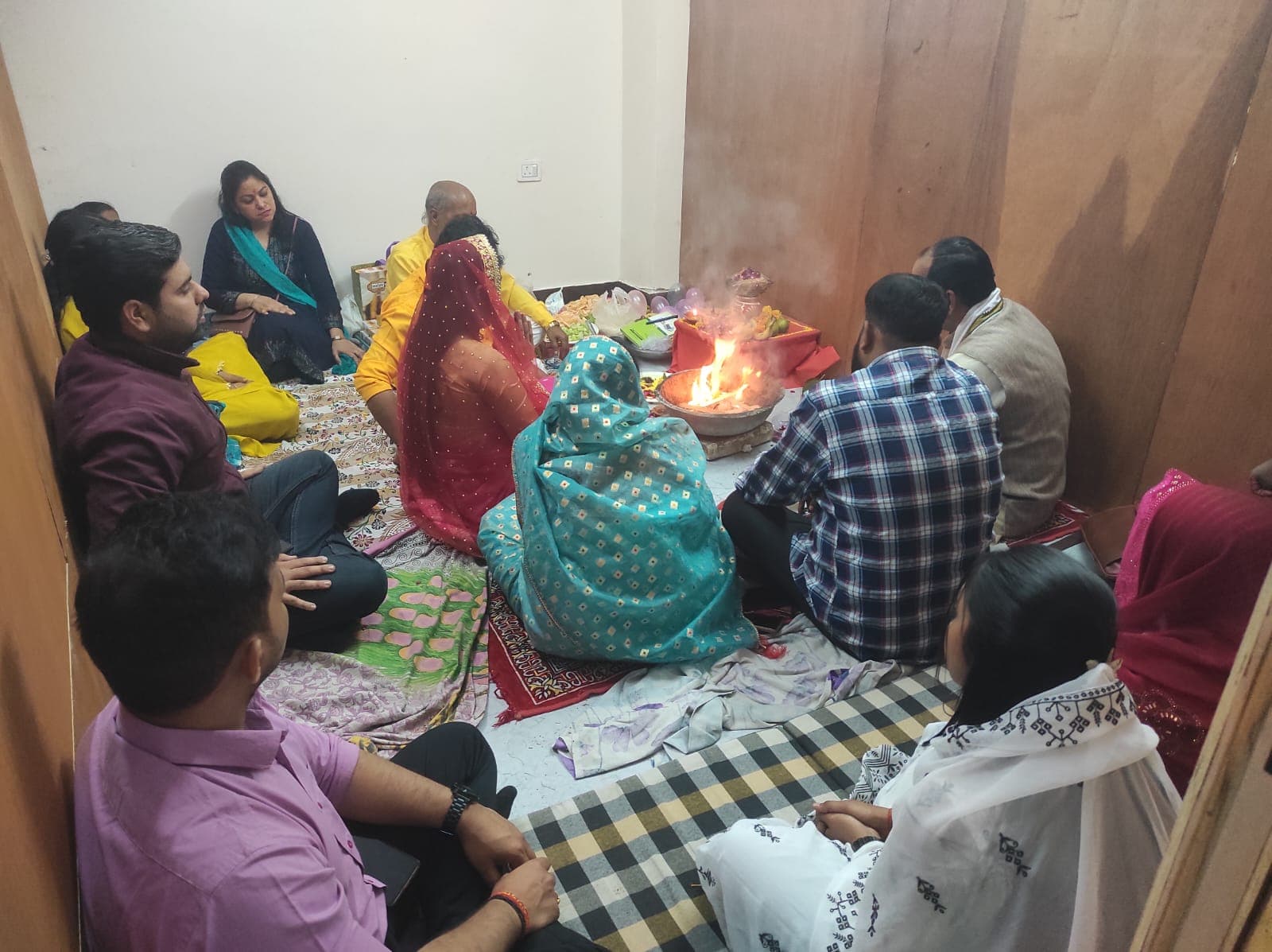 Faculty seated around the havan kund