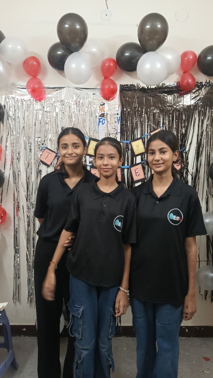Three ESA students posing on Teachers' Day 2026 at the Rohini centre